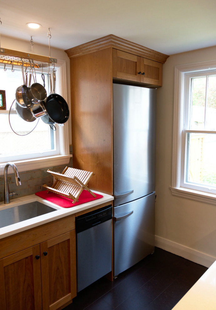Enclosed kitchen - small transitional galley cork floor and brown floor enclosed kitchen idea with a single-bowl sink, shaker cabinets, medium tone wood cabinets, quartz countertops, green backsplash, ceramic backsplash, stainless steel appliances, no island and white countertops
