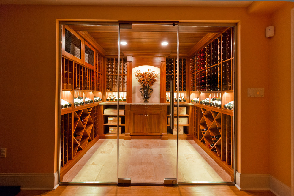 This is an example of a mid-sized traditional wine cellar in Other with ceramic floors and storage racks.
