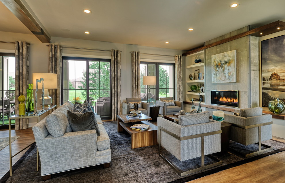 Inspiration for a mid-sized transitional open concept living room in Omaha with beige walls, vinyl floors, a ribbon fireplace, a tile fireplace surround, no tv and beige floor.