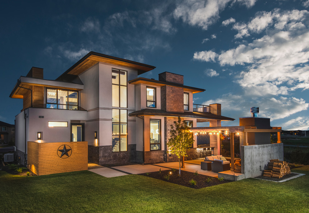 Example of a transitional exterior home design in Calgary