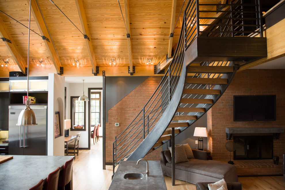 This is an example of a contemporary wood curved staircase in Other with open risers.