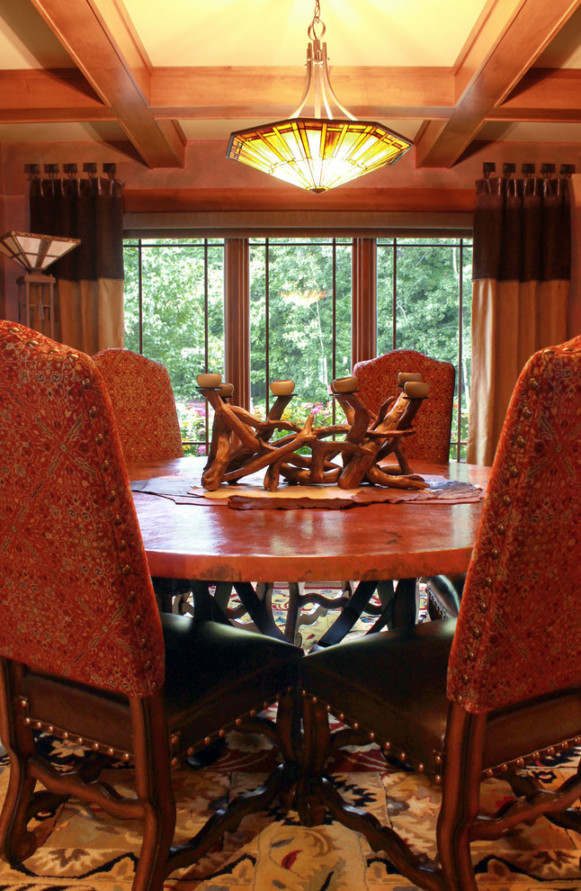 Mid-sized mountain style light wood floor kitchen/dining room combo photo with yellow walls and no fireplace
