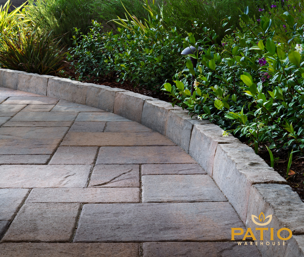 This is an example of a country backyard patio in Orange County with concrete pavers.