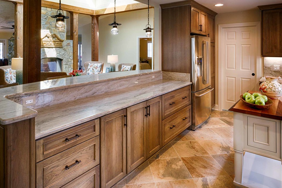 U-shaped porcelain tile kitchen photo in DC Metro with quartzite countertops and an island