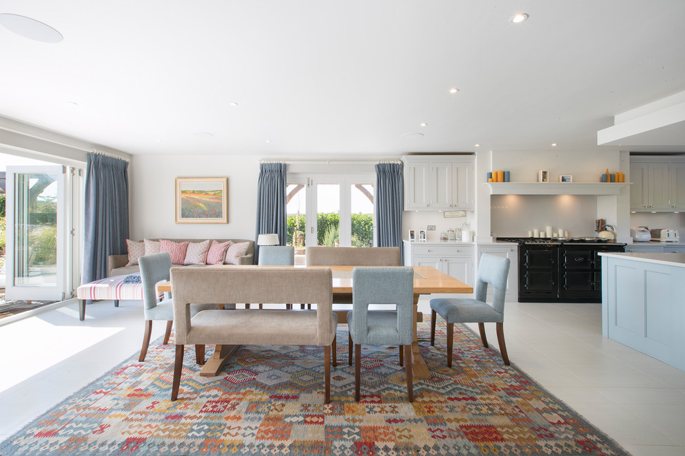 Inspiration for a country open plan dining in Dorset with white walls and white floor.