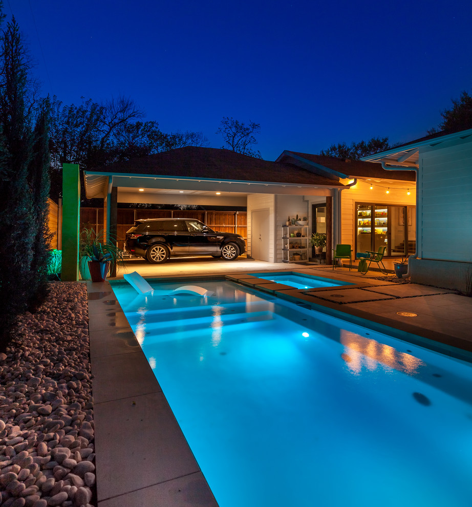 Inspiration for a small contemporary backyard l-shaped pool in Dallas with concrete pavers.