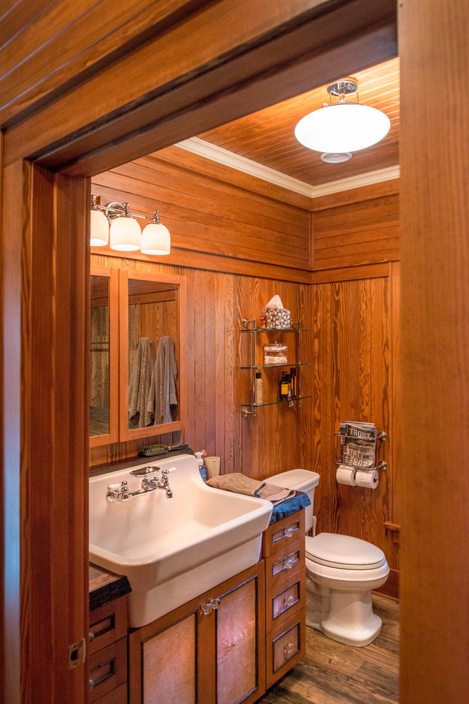 Design ideas for a small country 3/4 bathroom in New York with recessed-panel cabinets, medium wood cabinets, dark hardwood floors, a drop-in sink, wood benchtops and brown floor.