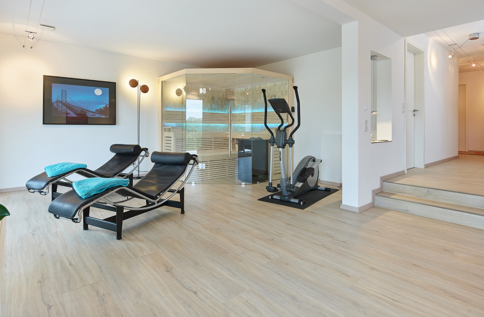 Design ideas for an expansive contemporary multipurpose gym with white walls.