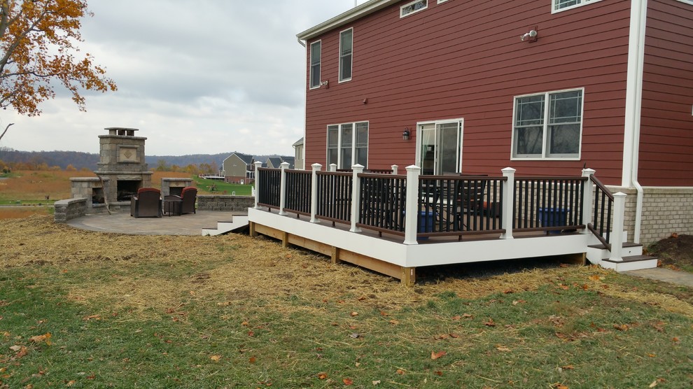 Inspiration for a mid-sized modern backyard deck remodel with a fire pit