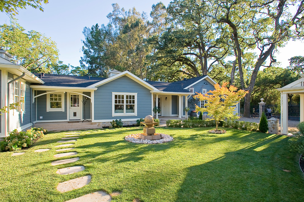 Photo of a mid-sized country one-storey blue exterior in San Francisco with wood siding.