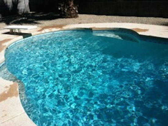 Backyard custom-shaped natural pool photo in Phoenix