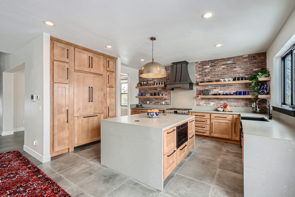 Eat-in kitchen - large transitional u-shaped cement tile floor and gray floor eat-in kitchen idea in Denver with a farmhouse sink, shaker cabinets, light wood cabinets, quartzite countertops, multicolored backsplash, brick backsplash, an island and gray countertops