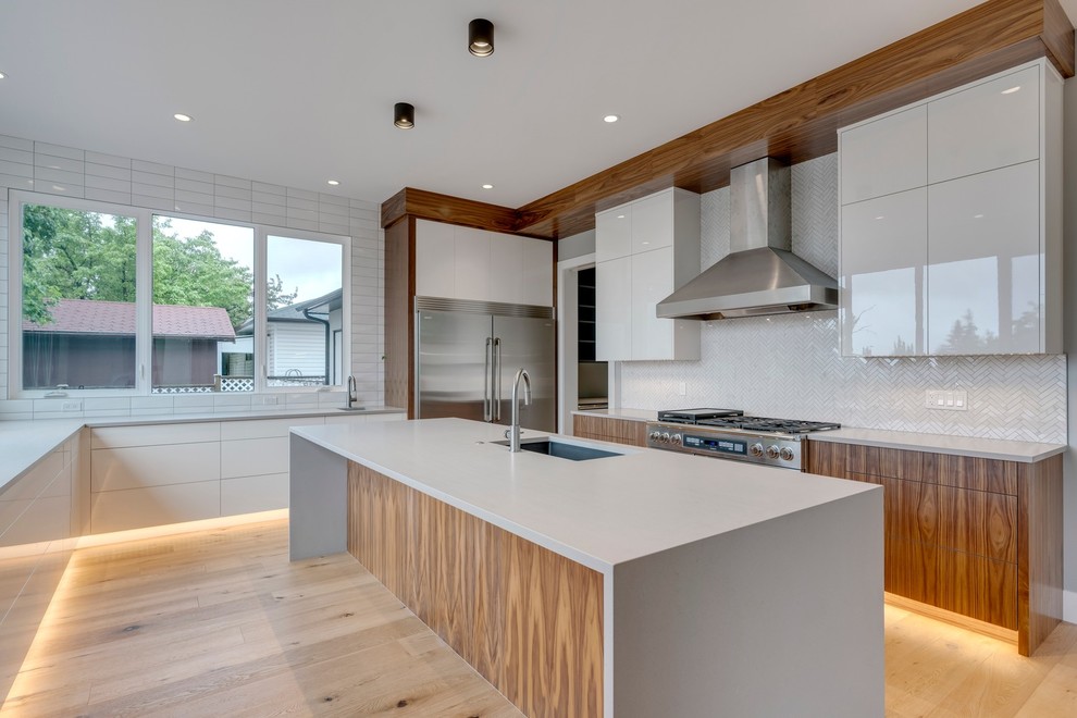 Example of a transitional kitchen design in Calgary