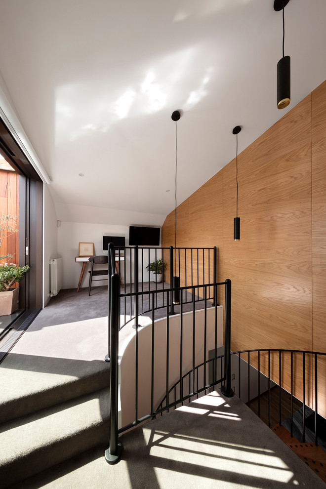 Photo of a mid-sized contemporary study room in Melbourne with white walls, carpet, a freestanding desk and grey floor.