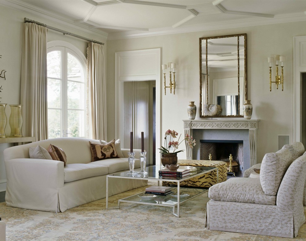 Inspiration for a traditional living room in New York with beige walls, a standard fireplace and a stone fireplace surround.