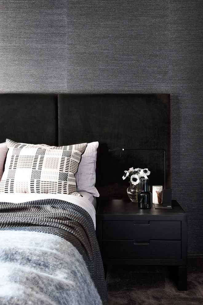Photo of a mid-sized contemporary guest bedroom in Sydney with black walls, carpet, no fireplace and grey floor.