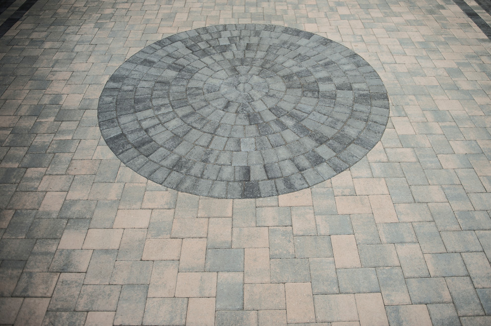 Inspiration for an expansive contemporary front yard driveway in Richmond with concrete pavers.