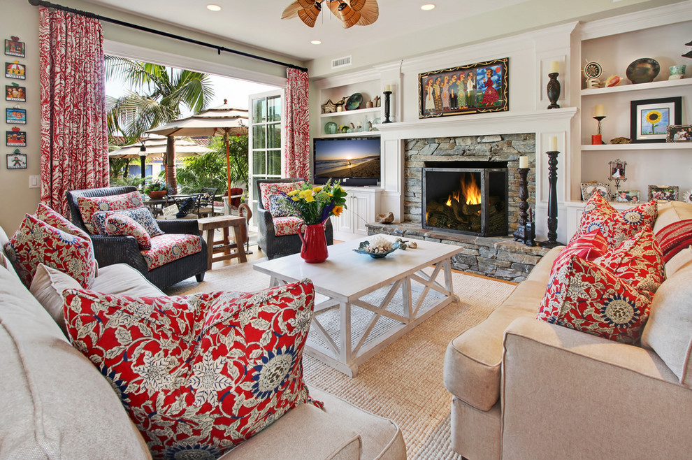 This is an example of a beach style living room in Orange County with a standard fireplace and a built-in media wall.