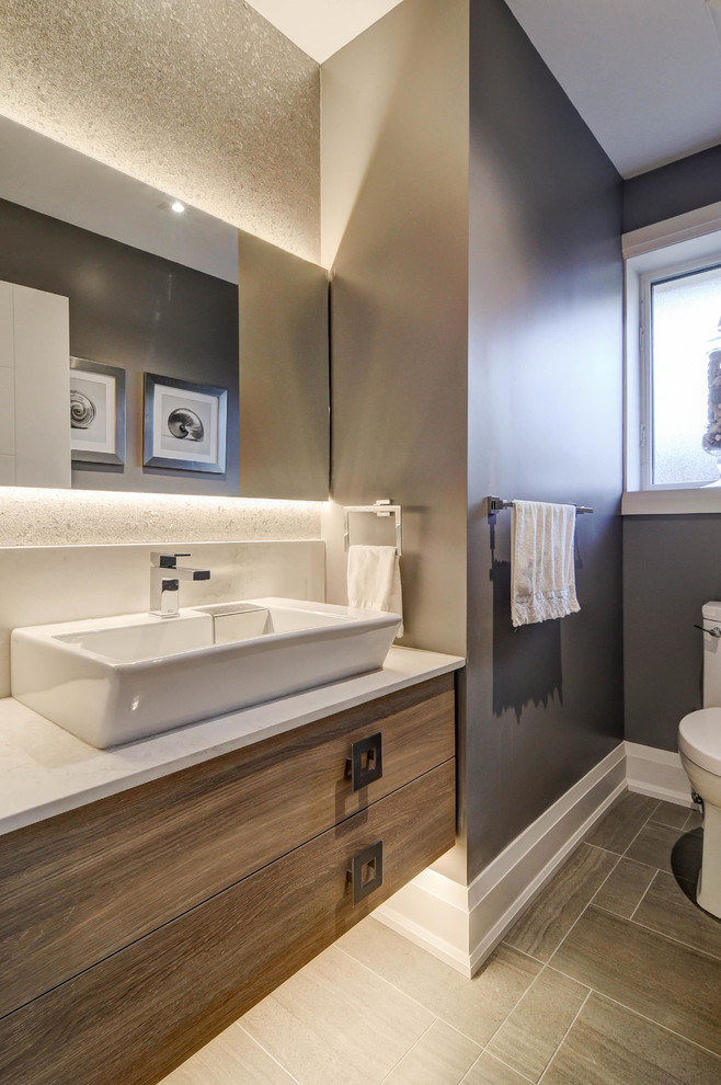 Mid-sized transitional 3/4 bathroom in Toronto with flat-panel cabinets, brown cabinets, a corner tub, a two-piece toilet, grey walls, medium hardwood floors, a vessel sink, solid surface benchtops and beige floor.
