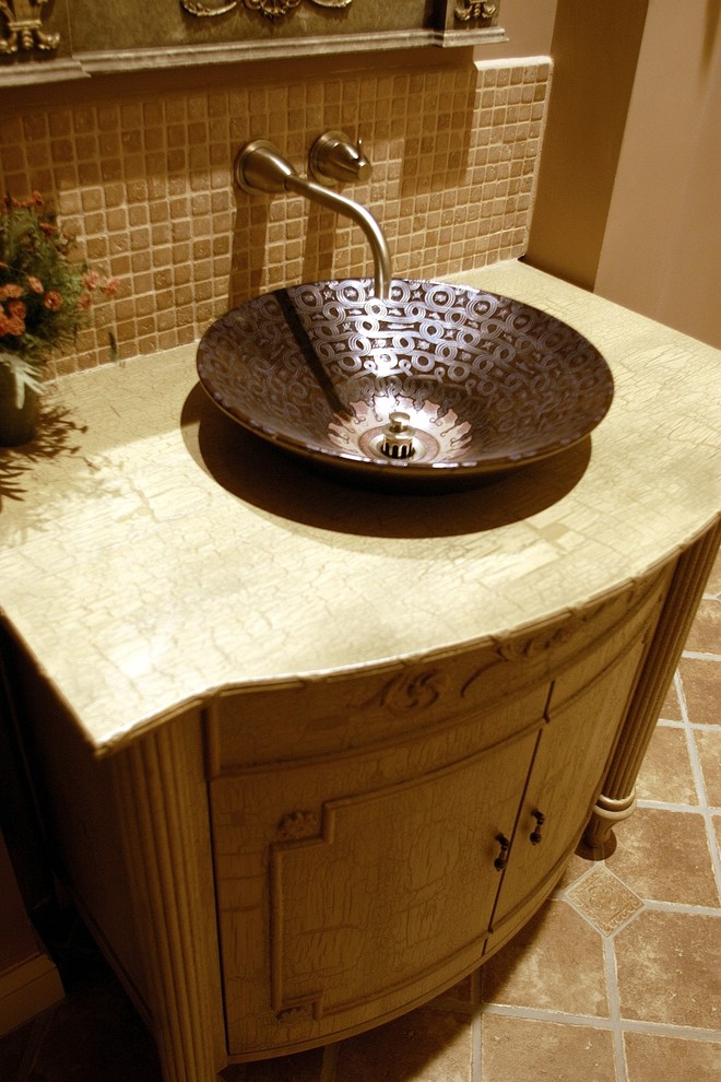 Example of a small classic beige tile and stone tile marble floor powder room design in Boston with a vessel sink, furniture-like cabinets, brown walls, medium tone wood cabinets, granite countertops and a two-piece toilet