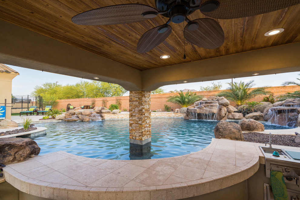 This is an example of a large country custom-shaped pool in Phoenix.