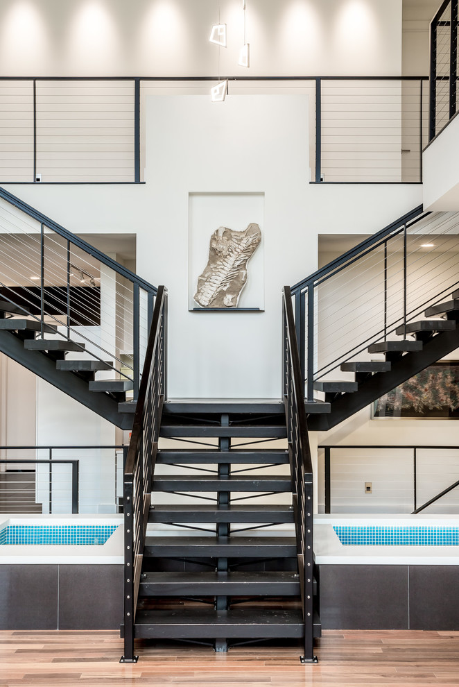 Inspiration for an expansive contemporary metal floating staircase in Minneapolis with open risers.