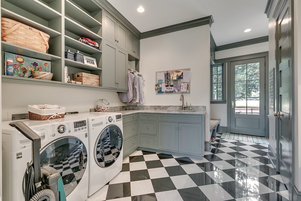 Country u-shaped laundry room in Other with an undermount sink, shaker cabinets, grey cabinets, white walls, multi-coloured floor and grey benchtop.