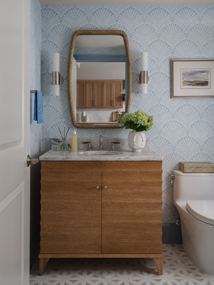 Inspiration for a mid-sized coastal beige floor and wallpaper powder room remodel in Tampa with flat-panel cabinets, brown cabinets and a freestanding vanity