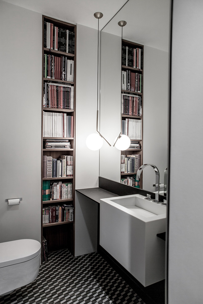Inspiration for a mid-sized contemporary bathroom in Other with a wall-mount toilet, black and white tile, gray tile, white walls, open cabinets, medium wood cabinets, a wall-mount sink and wood benchtops.