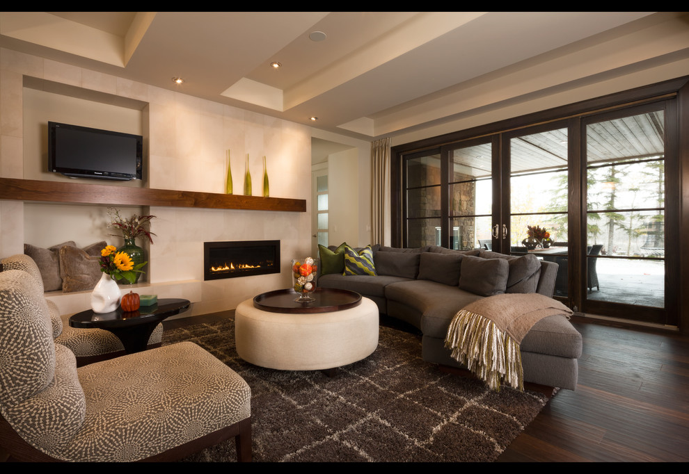 Example of a transitional formal and open concept dark wood floor home design design in Calgary with beige walls, a ribbon fireplace and a wall-mounted tv