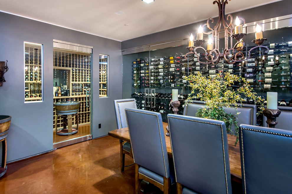 Design ideas for a traditional wine cellar in San Francisco with concrete floors and display racks.