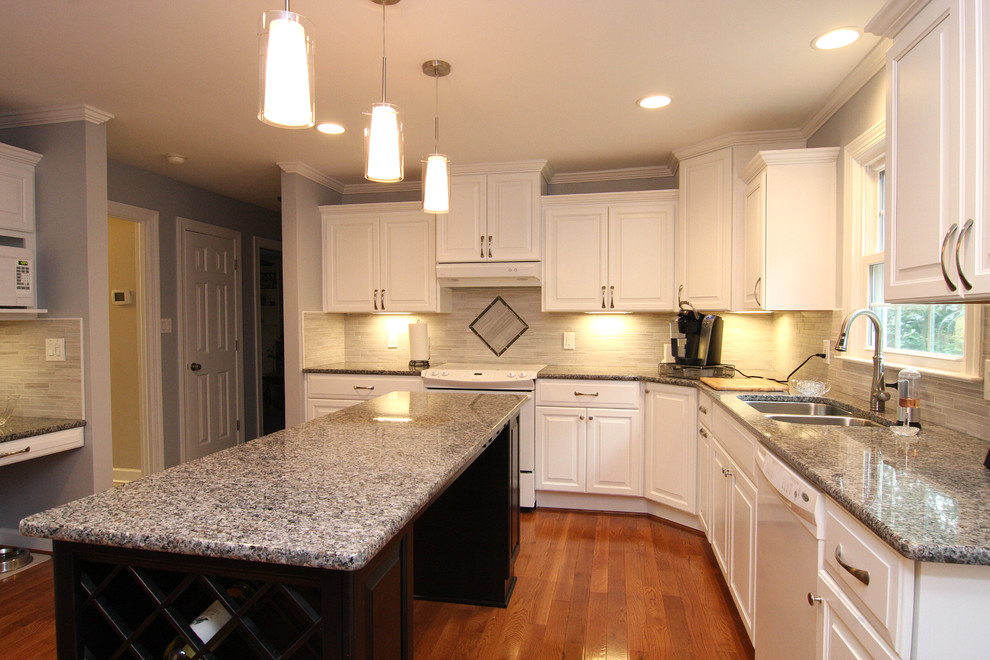 Eat-in kitchen - mid-sized transitional u-shaped medium tone wood floor eat-in kitchen idea with an undermount sink, raised-panel cabinets, white cabinets, granite countertops, gray backsplash, porcelain backsplash, white appliances and an island