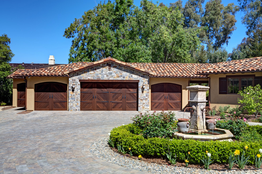 This is an example of a mediterranean attached four-car garage in San Francisco.