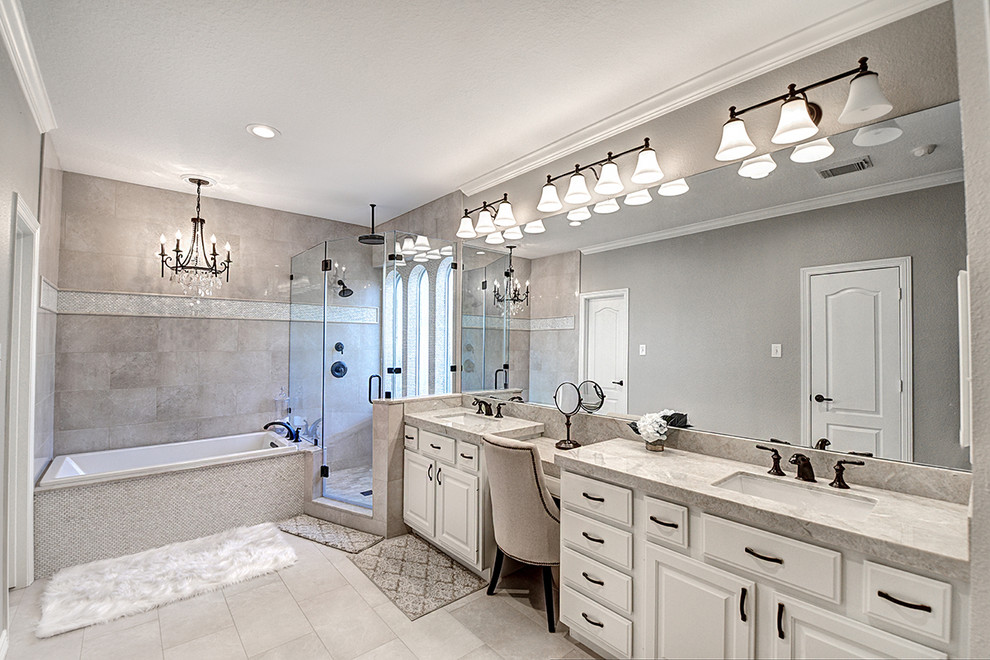 Inspiration for a transitional master bathroom in Houston with raised-panel cabinets, white cabinets, a drop-in tub, a double shower, beige tile, porcelain tile, grey walls, porcelain floors, an undermount sink and quartzite benchtops.