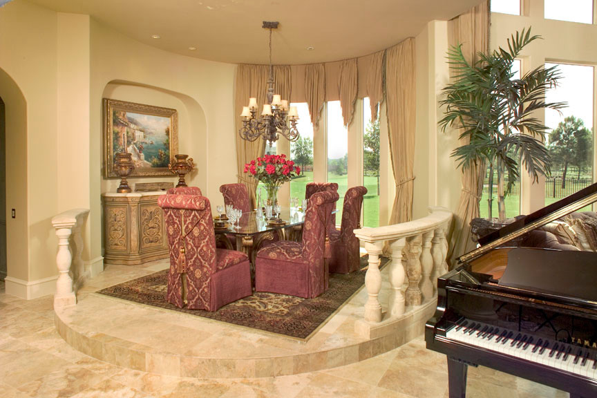 Inspiration for an expansive mediterranean open plan dining in Houston with beige walls and travertine floors.