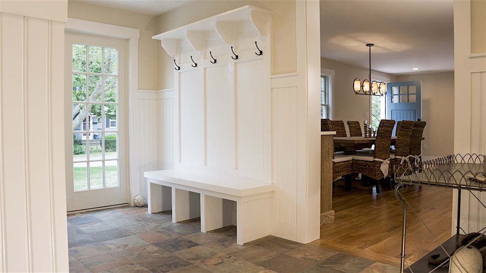 Mudroom - mid-sized transitional slate floor and brown floor mudroom idea in Boston with beige walls and a white front door