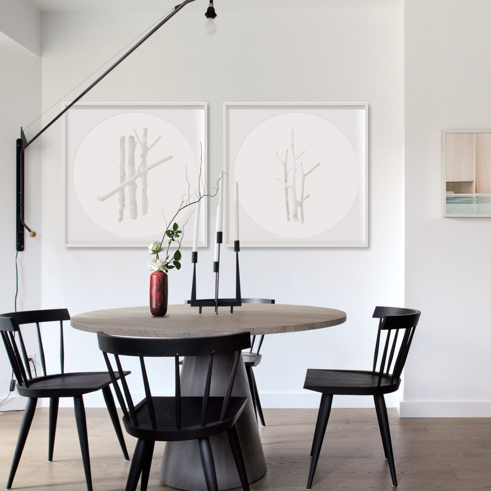 This is an example of a mid-sized scandinavian dining room in Toronto with white walls, medium hardwood floors and no fireplace.
