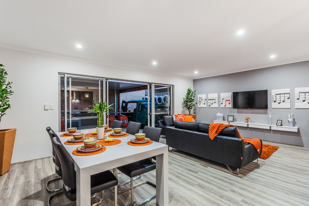 Design ideas for a contemporary open plan dining in Perth with grey walls and light hardwood floors.