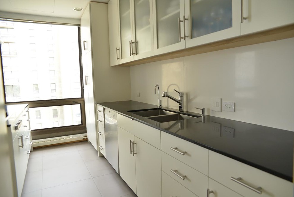 Large trendy l-shaped ceramic tile eat-in kitchen photo in Orange County with white cabinets, stainless steel appliances and an island