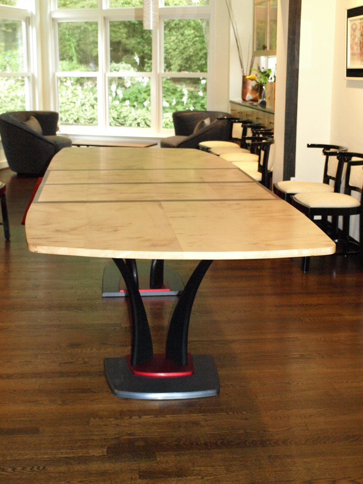 Example of a mid-sized transitional dark wood floor and brown floor enclosed dining room design with beige walls