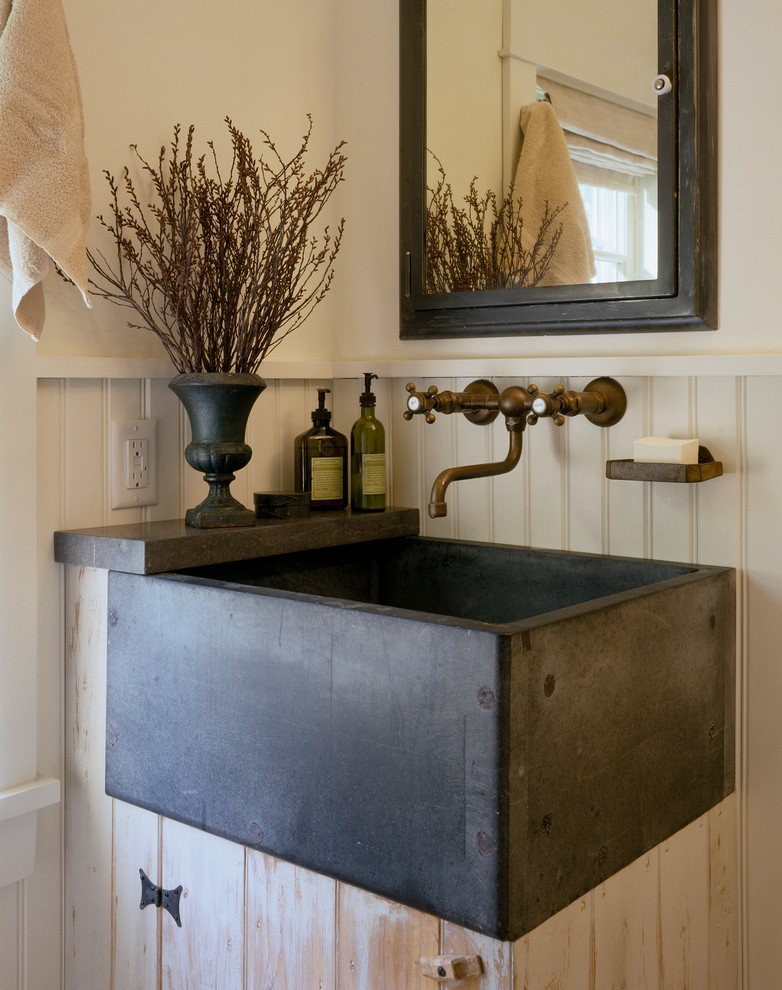 Country bathroom in Portland Maine with a wall-mount sink.