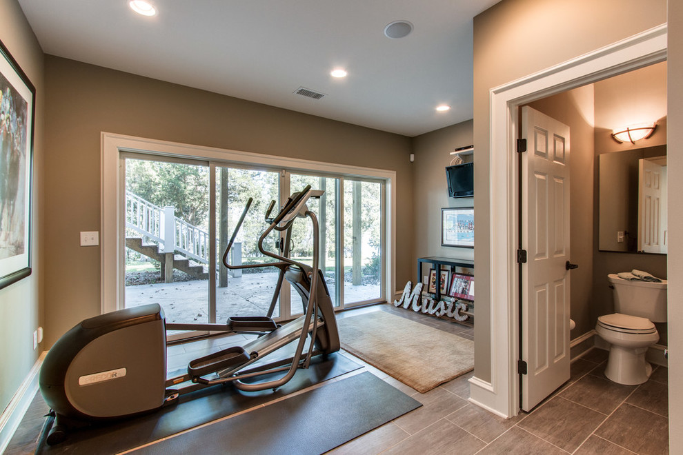 Small transitional home weight room in Kansas City with green walls and porcelain floors.