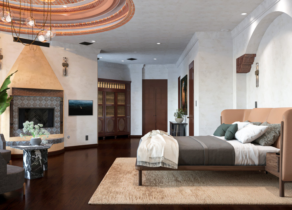 Источник вдохновения для домашнего уюта: огромная хозяйская спальня в средиземноморском стиле с бежевыми стенами, темным паркетным полом, стандартным камином, фасадом камина из плитки, коричневым полом и сводчатым потолком