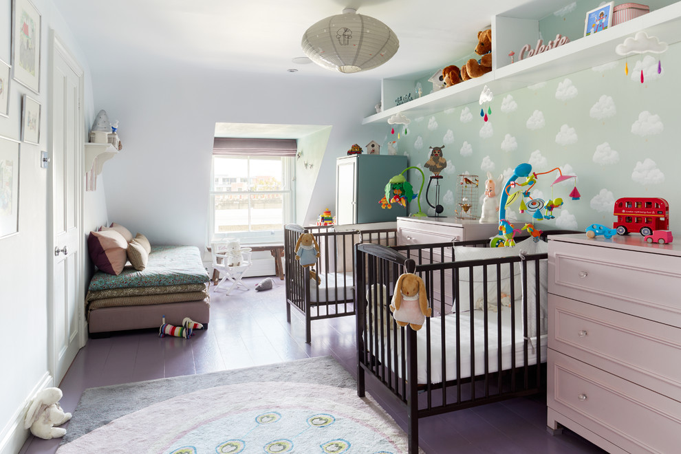 Photo of a contemporary gender-neutral nursery in London with white walls, painted wood floors and purple floor.