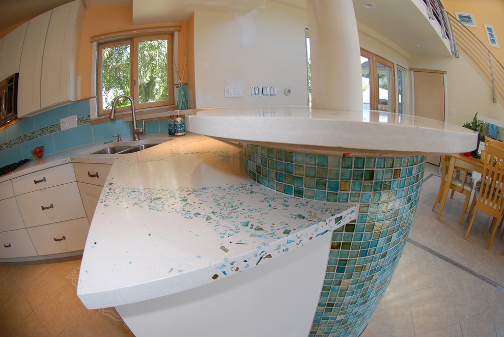 Photo of a large contemporary eat-in kitchen in Philadelphia with concrete benchtops, blue splashback and with island.