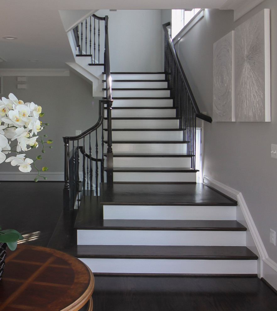 Example of a large transitional wooden l-shaped mixed material railing staircase design in DC Metro with painted risers