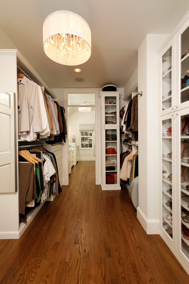 Photo of a traditional storage and wardrobe in DC Metro with white cabinets and medium hardwood floors.