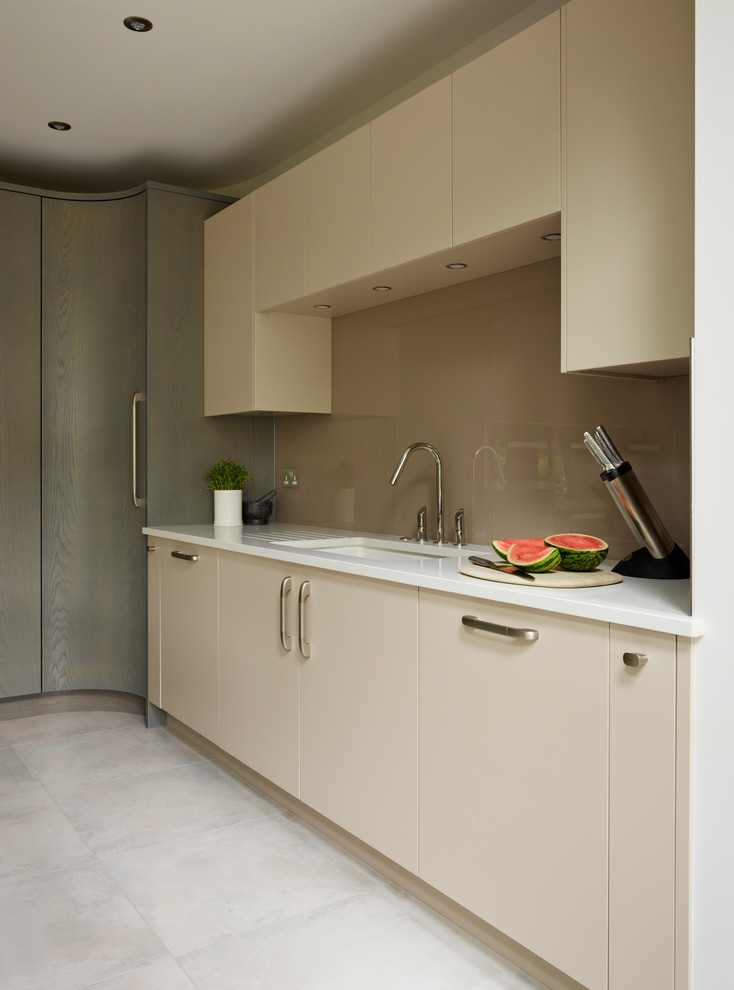 Inspiration for an expansive contemporary kitchen in Essex with flat-panel cabinets, grey cabinets and with island.