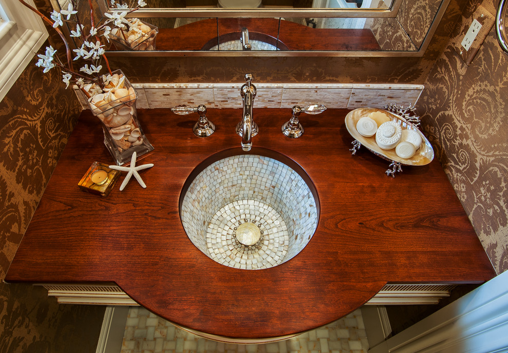 This is an example of a small eclectic bathroom in Bridgeport with an undermount sink and wood benchtops.
