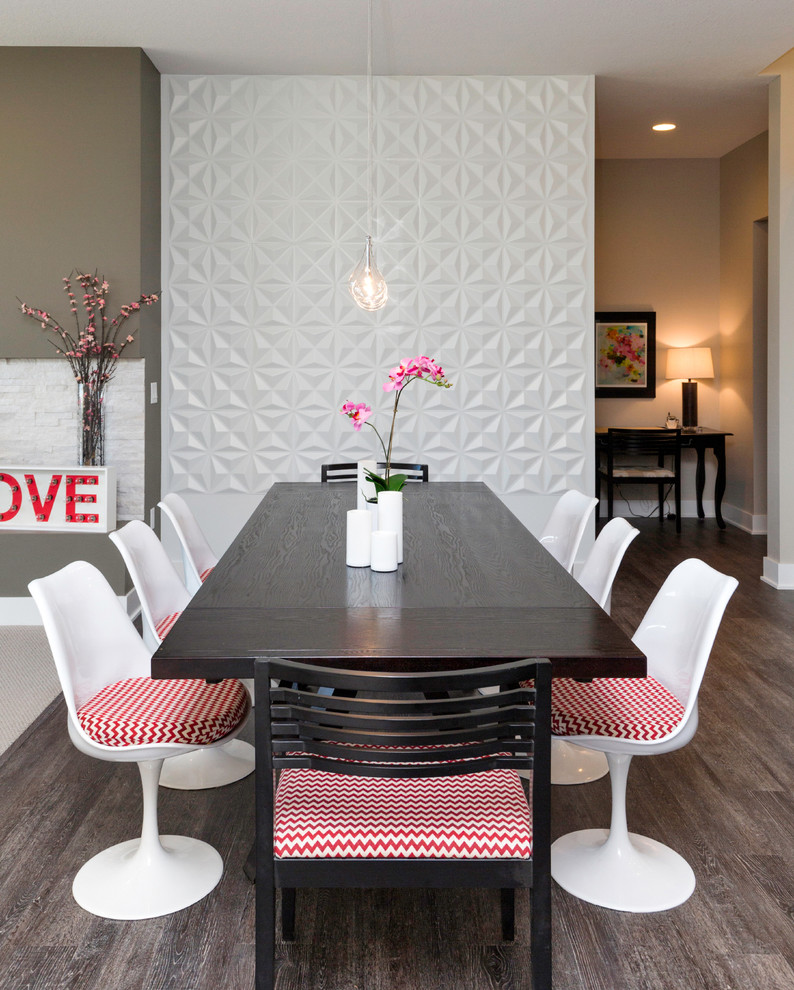 Example of a mid-sized trendy medium tone wood floor and brown floor great room design with gray walls and no fireplace